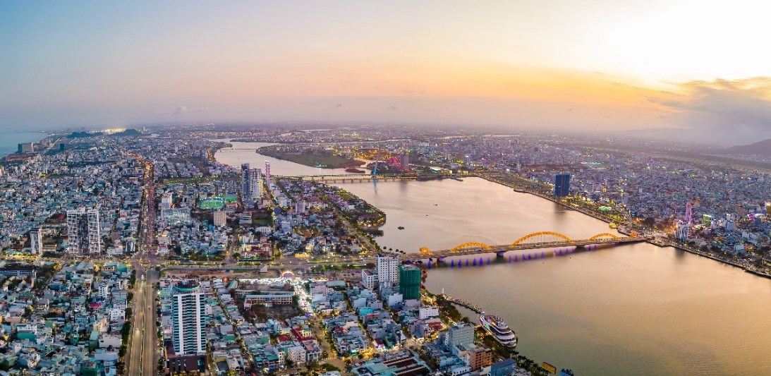 A city with a river and a bridge  AI-generated content may be incorrect.