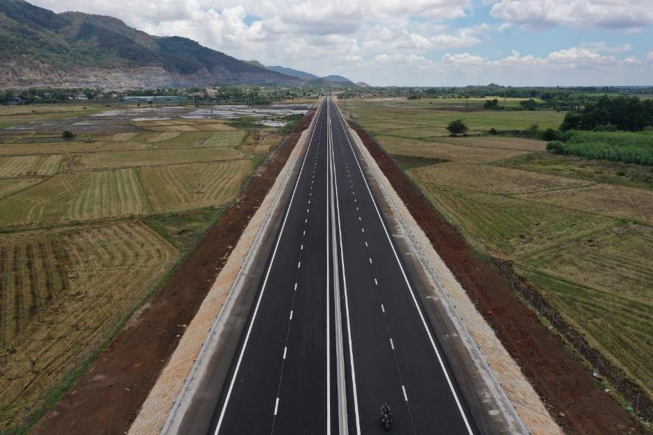 A long straight road with a bike on it  AI-generated content may be incorrect.