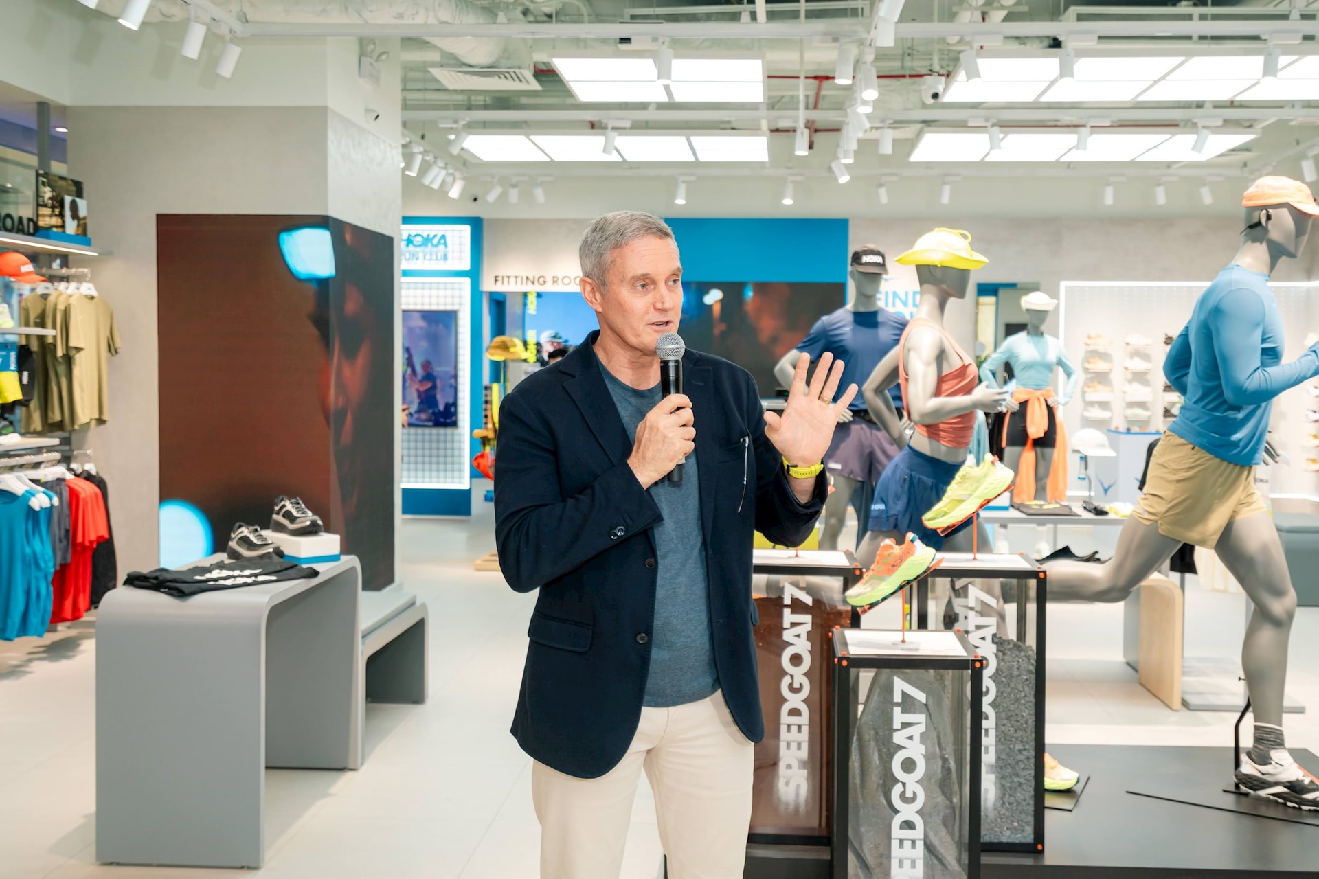 A person holding a microphone in a store  AI-generated content may be incorrect.