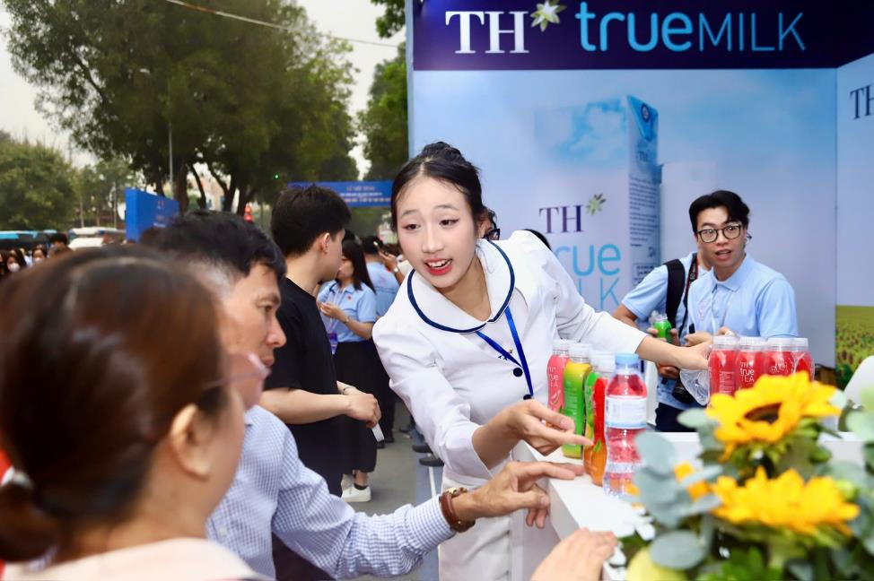 A group of people at a table with drinks  AI-generated content may be incorrect.