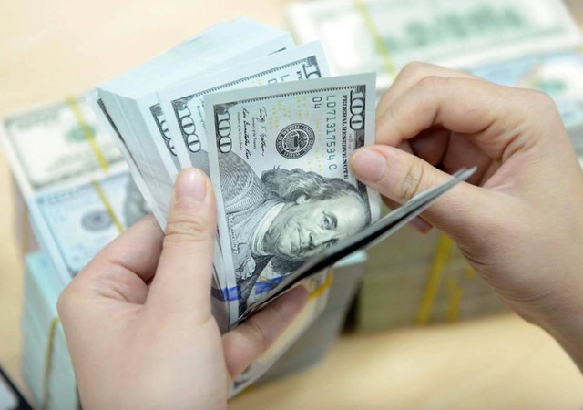 Dự báo tỷ giá có thể vượt 27.000 VND/USD vào cuối năm 2026- Ảnh 1. Dự báo tỷ giá có thể vượt 27.000 VND/USD vào cuối năm 2026- Ảnh 1.
